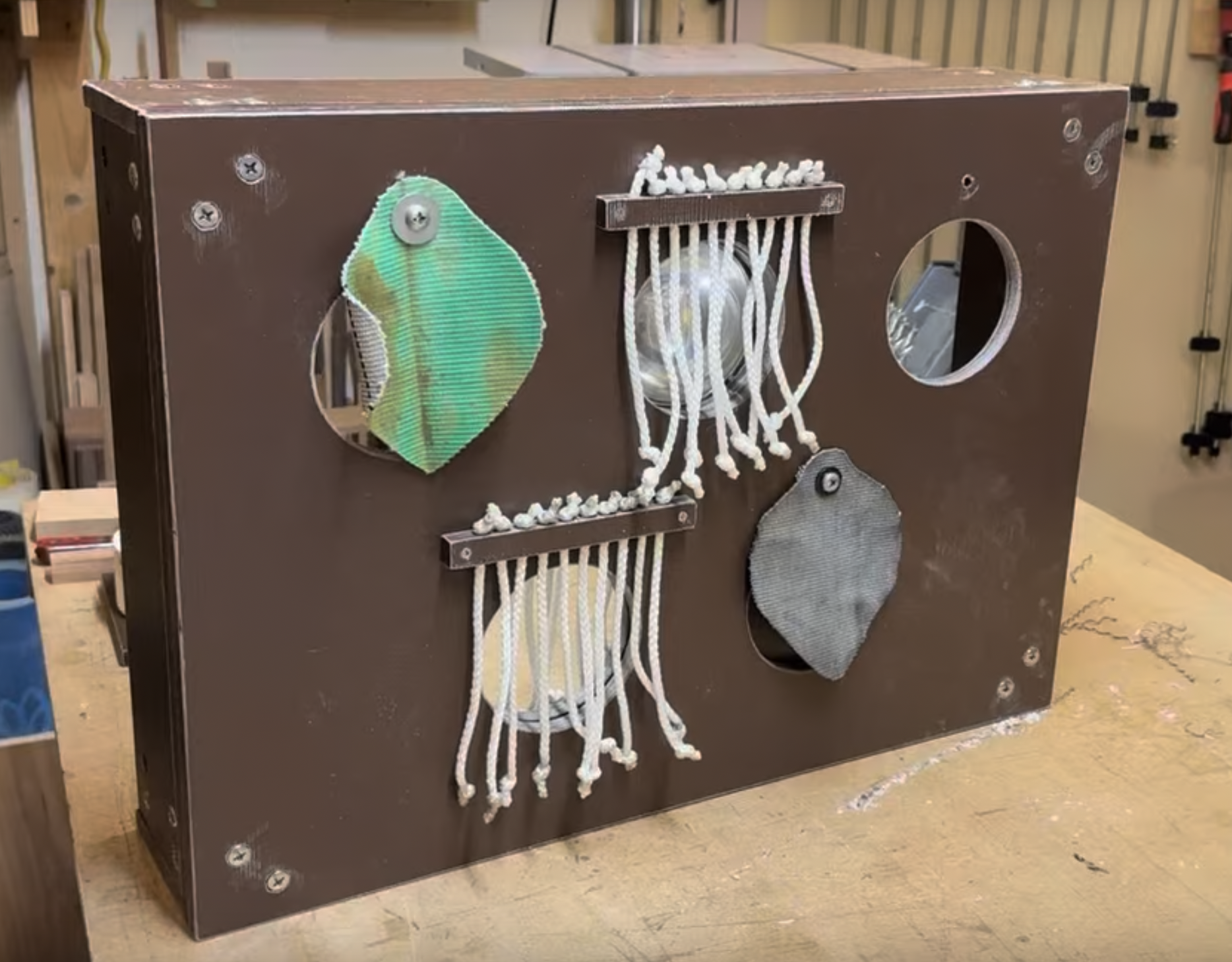 In-construction prototype, built using sturdy HDPE plastic and stainless steel, weatherproof fastenings. We narrowed down the module cover selection to just firehose leaves and synthetic rope. Various mirror modules are hidden behind covers.
